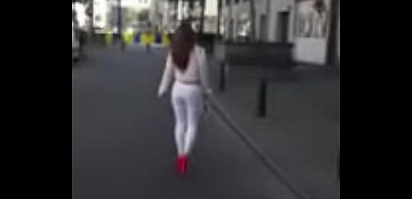  7321620 hooker walking in the street in sexy high heels and legging